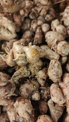 	
Close up pile of tasty aromatic ginger sold at the market as a background.	
