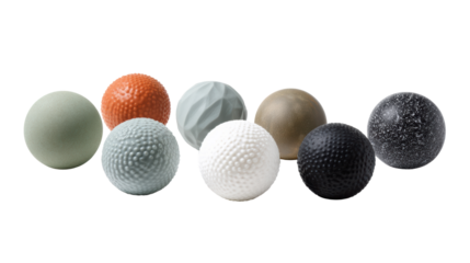 Assorted tactile balls, various textures, white isolated background.