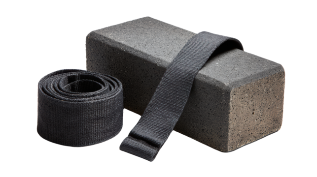 Yoga block and strap on a white isolated background for fitness and exercise enthusiasts.