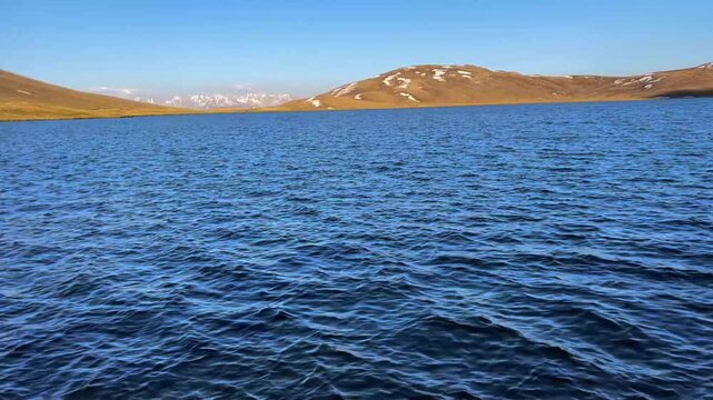 Sheosar Lake in Deosai National Park, Pakistan, sits at 4,142 meters. The video captures its crystal-clear blue water, ideal for nature, travel, and landscape themes in creative video projects.


