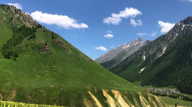 In the heart of Minimarg, a lush green mountain rises in silent glory. Distant homes rest peacefully on its slopes, echoing harmony between nature and human life in Skardu,&nbsp;Pakistan.