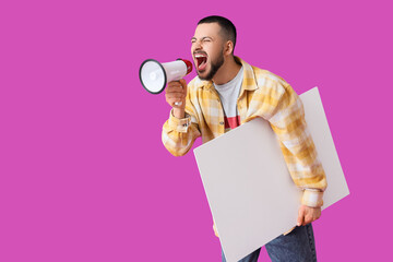 Young man with blank poster shouting into megaphone on violet background. Artist as Outlaw Day