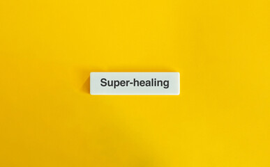 Super-healing Phrase on Letter Tile Against Yellow Background – Minimalist Wellness and Recovery Concept