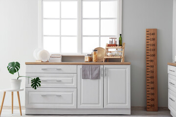 Interior of light kitchen with counters and stadiometer