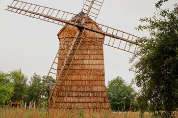 Full Landscape Shot of Traditional Polish Slavic Windmill in Countryside Setting