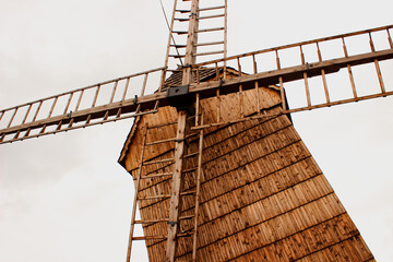 Front View of Traditional Slavic Polish Wooden Windmill with Visible Grain Blades