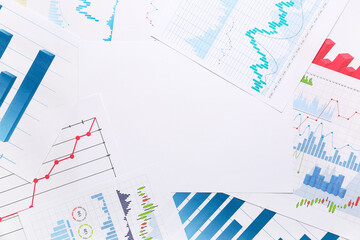 Blank paper with many business graphics and diagrams as background, closeup