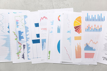 Many business graphics and diagrams on grunge grey background