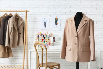 Mannequin with stylish jacket in atelier