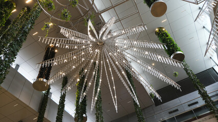 luxurious crystal chandelier on the ceiling. bottom view. close-up. shining chandelier hanging on a...