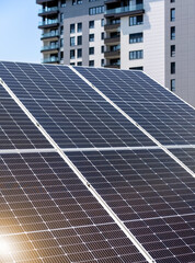 Modern solar panel in front of city residential area