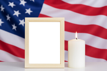 Patriotic memorial display with american flag, candle, and empty frame