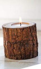 Single Log Candle Holder with Lit Tealight for Cozy Romantic and Eco-Themed Interiors