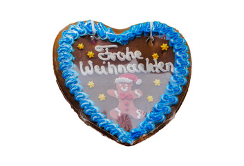 Lebkuchenherz Frohe Weihnachten Lebkuchenmännchen freigestellt isoliert studio
