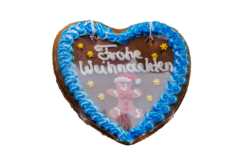 Lebkuchenherz Frohe Weihnachten Lebkuchenmännchen freigestellt isoliert studio