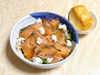 Salad with salmon and cheese, and a small piece of bread