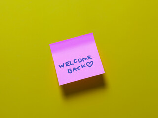 Welcome back note on bright yellow background
