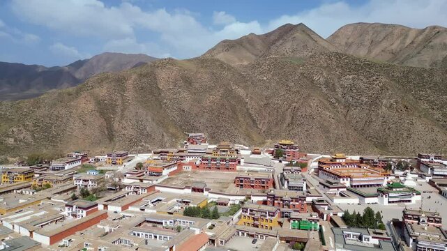 Xiahe, China: Aerial drone footage of ancient temples in the Tibetan Buddhism Labrang Monastery in the Xiahe town on the Tibetan plateau.