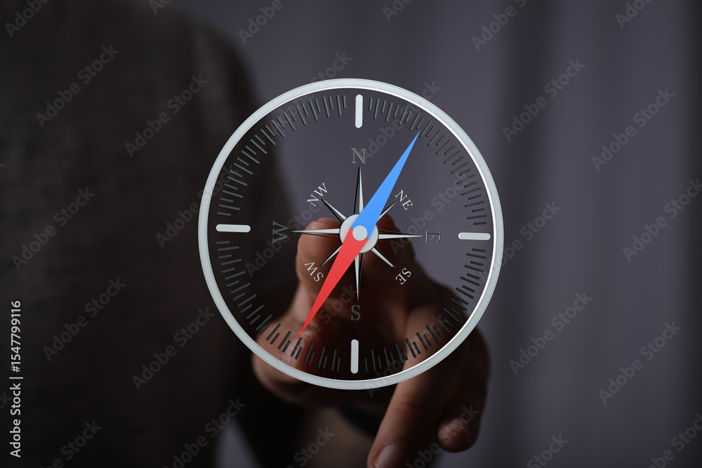 Poster person using a digital compass for navigation. find your direction.