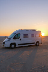 Enjoying a sunset by the beach in Denmark from a cozy camper van