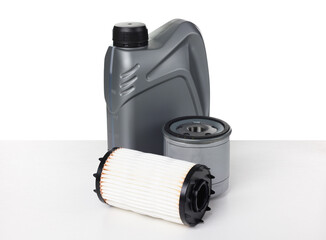 Motor oil in plastic canister and filters isolated on white