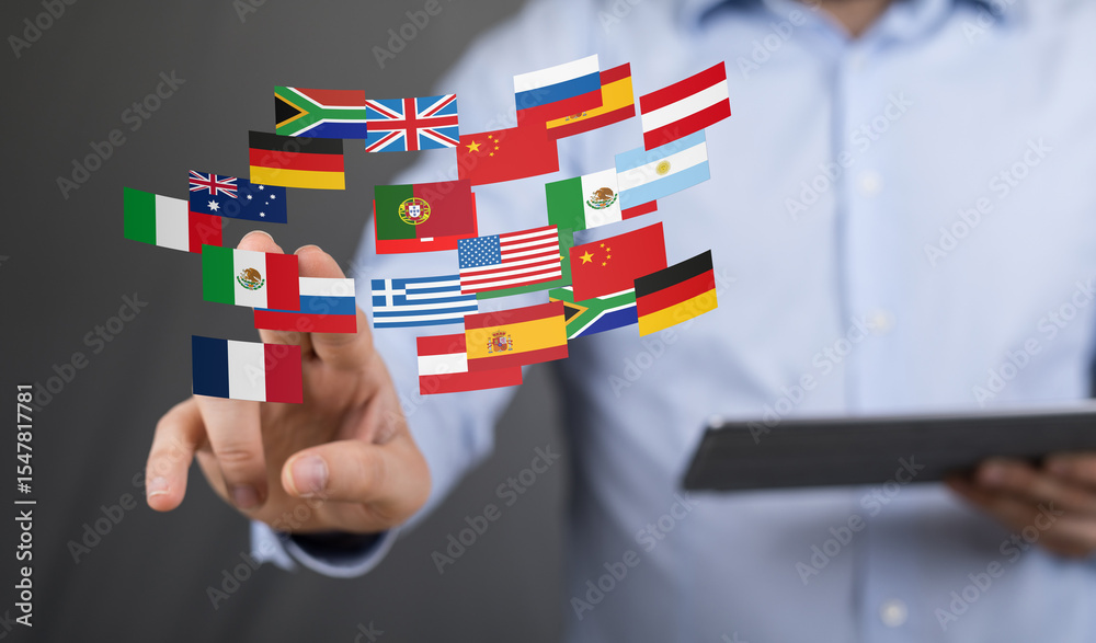 Poster image of a man interacting with digital flags representing global business and communication.