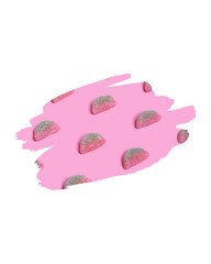 Pink background displaying a pattern of strawberry-shaped gummy candies.
