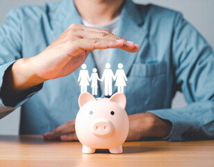 Saving for family: Man protecting piggy bank with family icon. Concept of financial security, family protection, insurance, and investment.