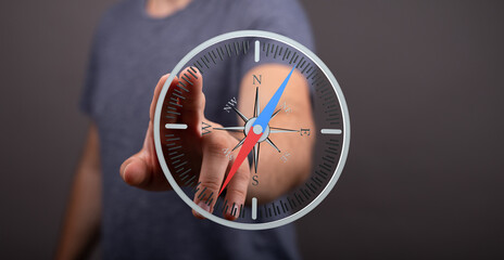 High-quality image of a person interacting with a digital compass, illustrating navigation and...