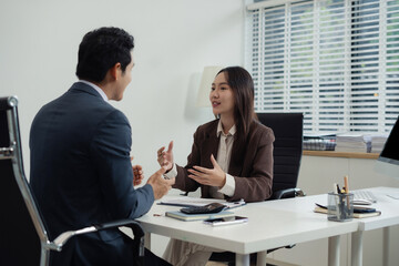 Businessmen team or financial data analysts working with tablets and laptop computers and data graphs together. Plan to analyzing projects in the office.