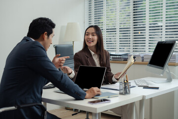 Businessmen team or financial data analysts working with tablets and laptop computers and data...