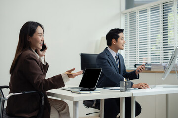 Businessmen team or financial data analysts working with tablets and laptop computers and data...