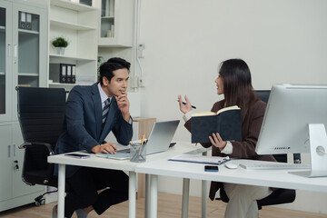 Businessmen team or financial data analysts working with tablets and laptop computers and data graphs together. Plan to analyzing projects in the office.