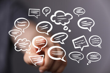 Image of hand interacting with speech bubbles, ideal for communication, teamwork, and social media...