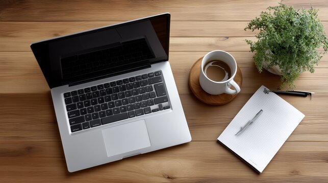 Workspace setup featuring laptop coffee notepad and plant. AI generated - Powered by Adobe