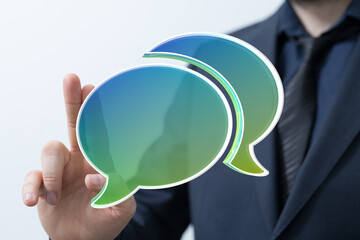 Image of a businessman showcasing a communication concept using speech bubbles. Ideal for business,...