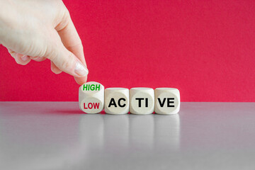 High or low active symbol. Hand turns a cube and changes the word High active to low active....