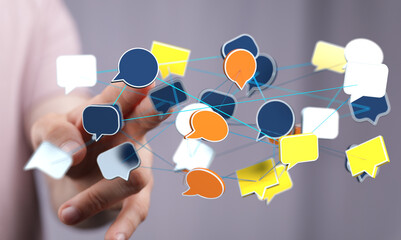 Hand interacting with a network of speech bubbles, symbolizing global communication and connection.