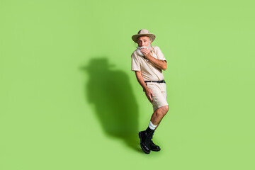 Photo of shy senior traveler man feel modest dangerous on wild life jungle wear safari suit...