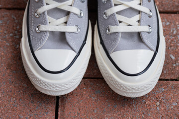 Street Style Simplicity. Neutral canvas shoes  captured in natural light.