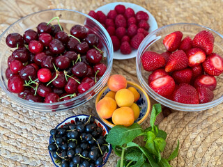 Fresh ripe summer fruits and berries on a table 
