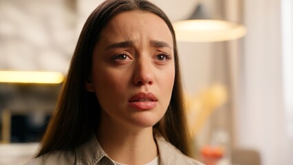 Upset emotional young Caucasian woman girl female sad frustrated dissatisfied crying indoors...
