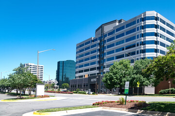 Modern business buildings in the city of Tysons in Virginia. Sunny day, blue sky.