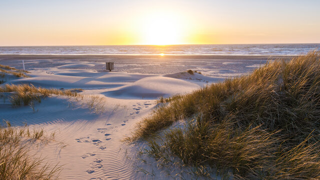 Sunset over the sandy beach dunes of Denmark creating a picturesque coastal landscape
