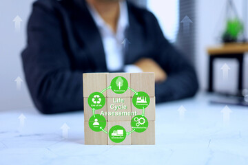 Life cycle assessment LCA concept with businessman show a wooden block arrange the cycle of...