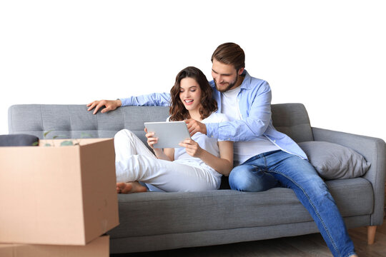 Happy couple sitting and planning new home decoration at home with a tablet at moving day, renovation and interior design for new house on a transparent background