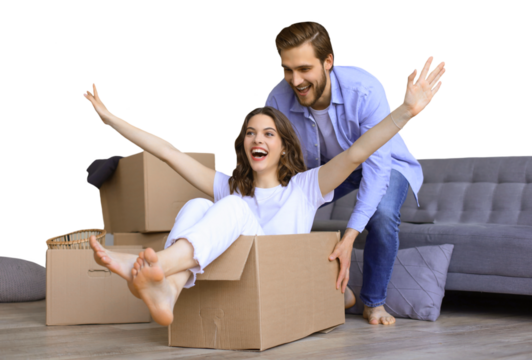 Happy couple is having fun with cardboard boxes in new house at moving day, woman riding sitting in cardboard box while man pushing it on a transparent background - Powered by Adobe