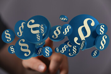3D rendering of paragraph symbols hovering near a hand, ideal for legal and law concepts.