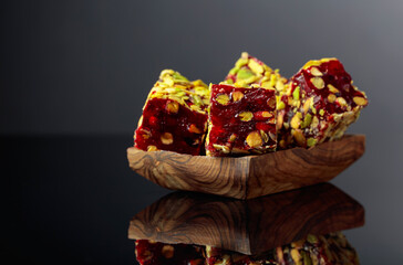 Traditional Turkish delight in a wooden dish.