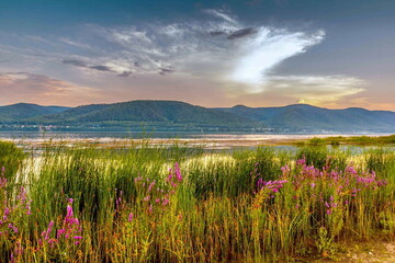 Magnificent landscape of the Volga River against the backdrop of the Zhiguli Mountains on a warm summer day